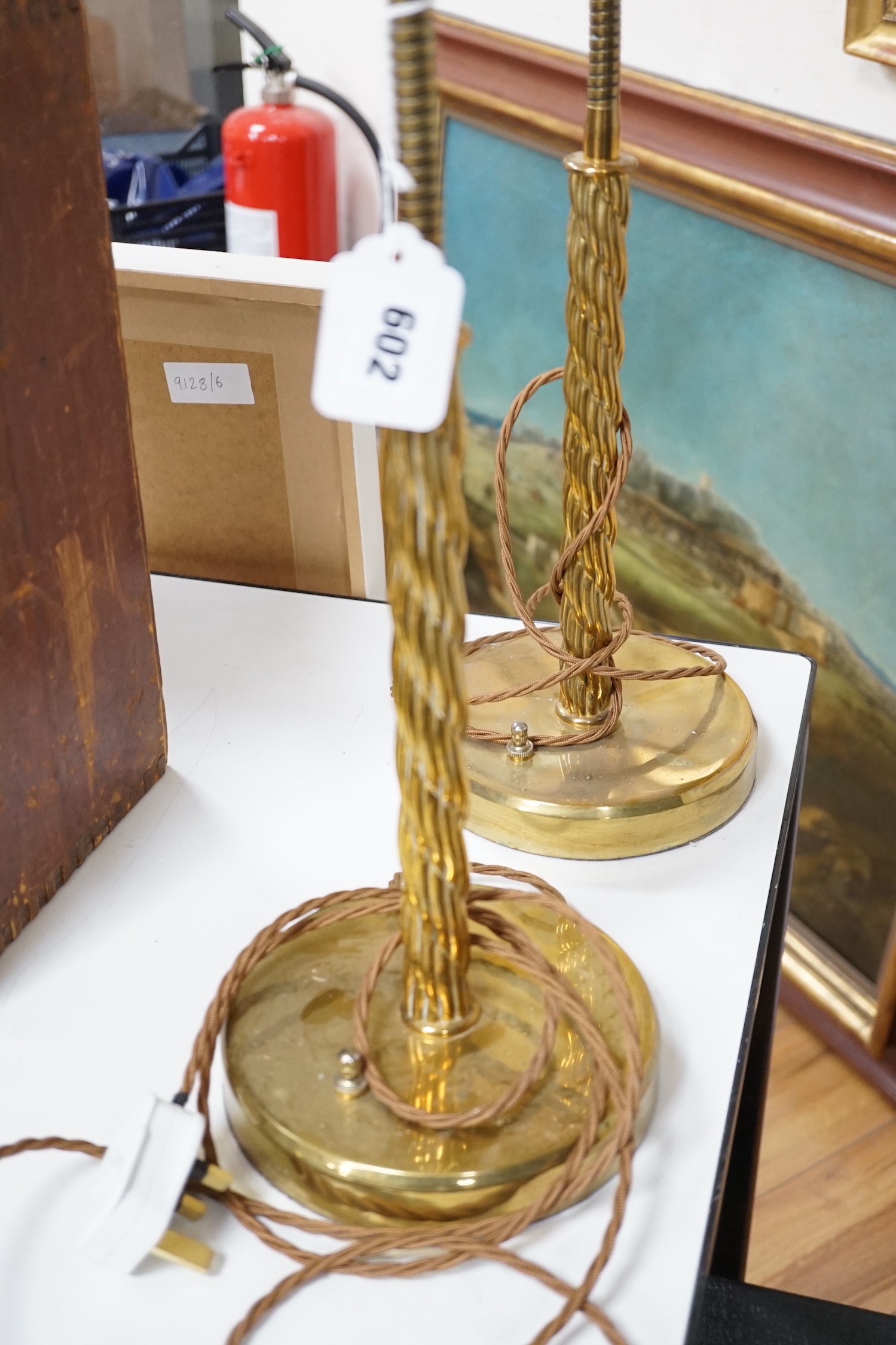 A pair of brass adjustable table / spot light lamps, 94cms high